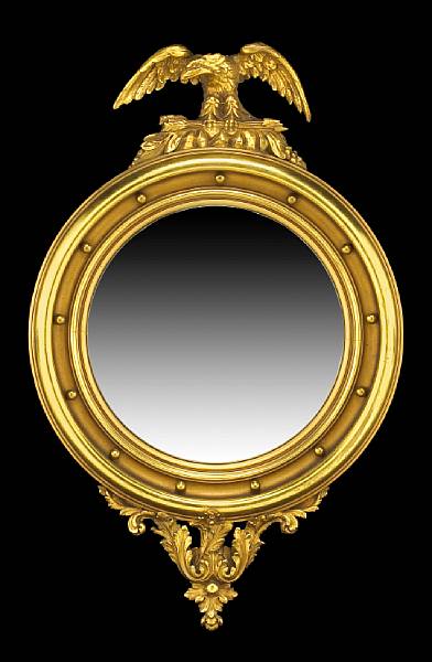 Appraisal: A Classical giltwood convex mirror American or English early th