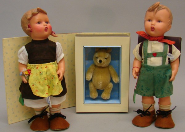 Appraisal: Lot Pair of vinyl Hummel dolls School boy with school