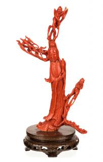 Appraisal: A CHINESE CARVED RED CORAL FIGURE OF A GUANYIN POURING