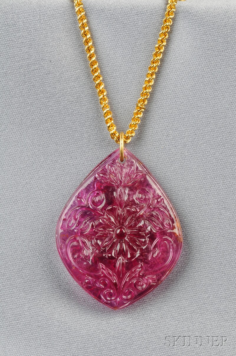 Appraisal: Carved Pink Tourmaline Pendant the tourmaline carved with floral motifs