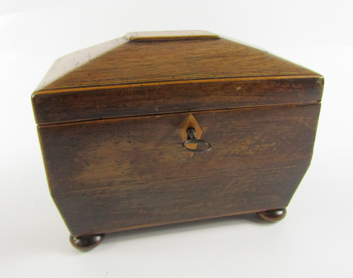 Appraisal: A Regency rosewood and boxwood line inlaid sarcophagus form tea