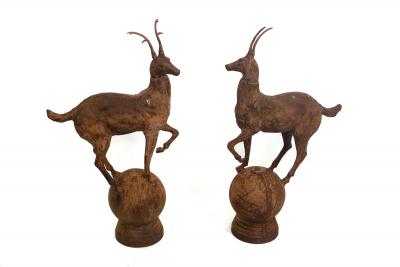 Appraisal: A pair of iron gate pier finials cast as deer