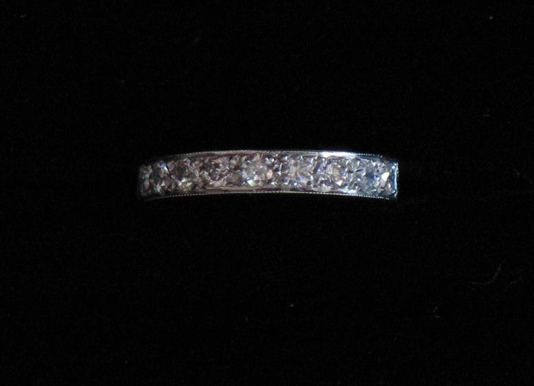 Appraisal: A HALF DIAMOND ETERNITY RING the ct white gold shank