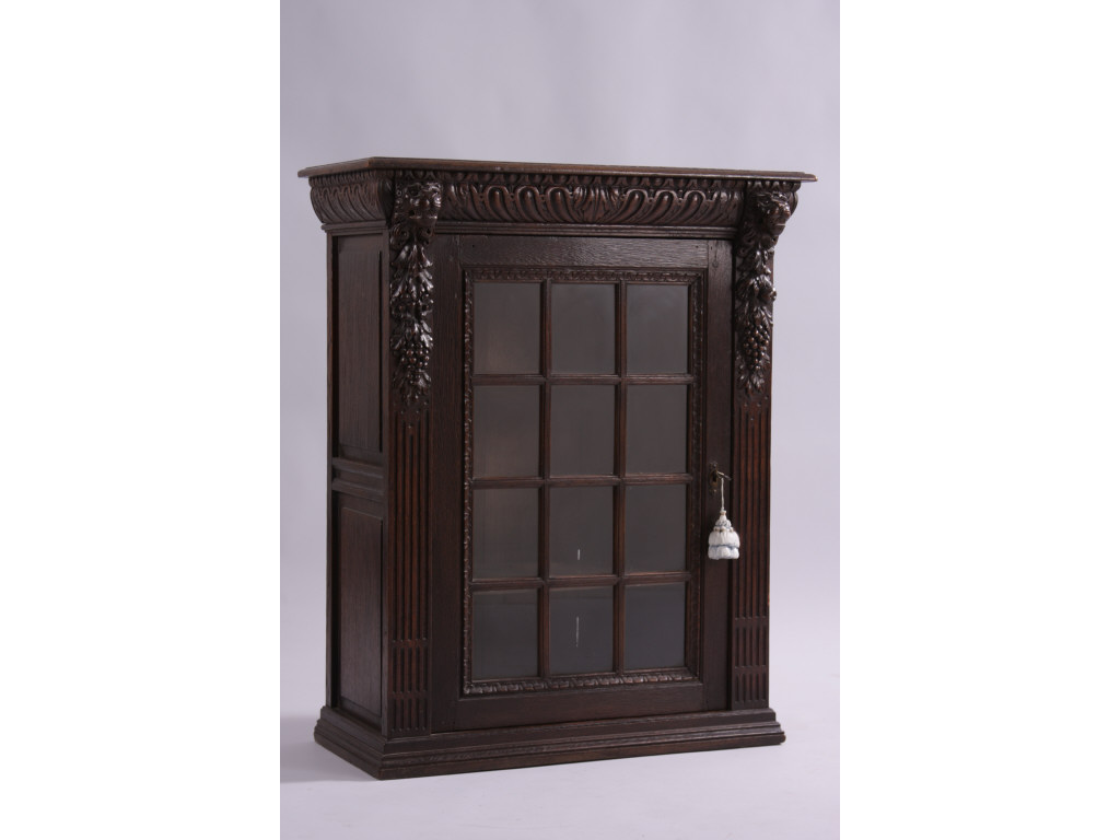 Appraisal: Flemish Hanging Cupboard th c oak molded top supported by