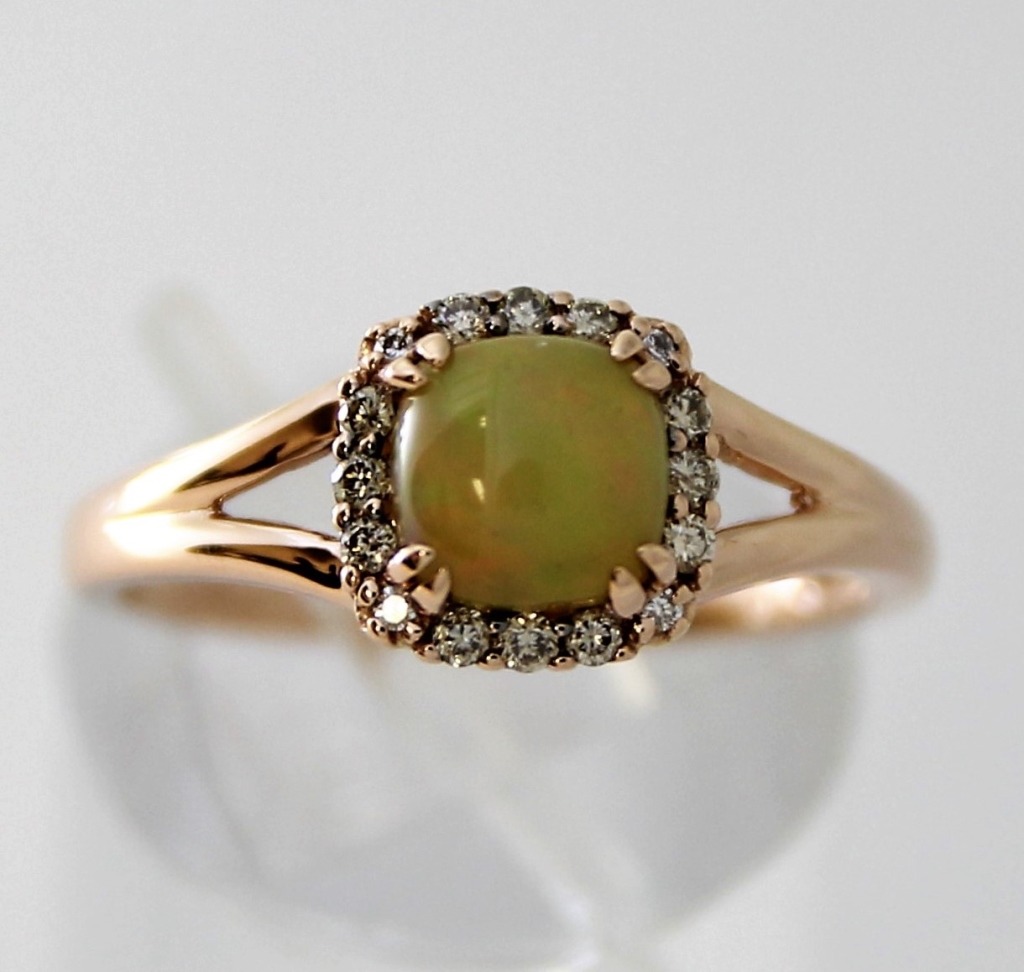 Appraisal: LEVIAN K STRAWBERRY GOLD OPAL DIAMOND RING ContemporaryRound cabochon opal