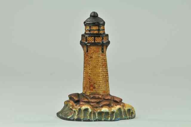 Appraisal: LIGHTHOUSE WITH SEA ROCKS DOORSTOP Nautical depiction of tall brick