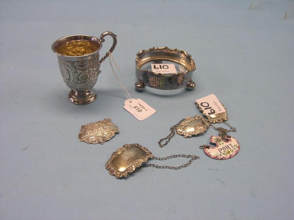 Appraisal: A group of four embossed silver wine labels an enamelled