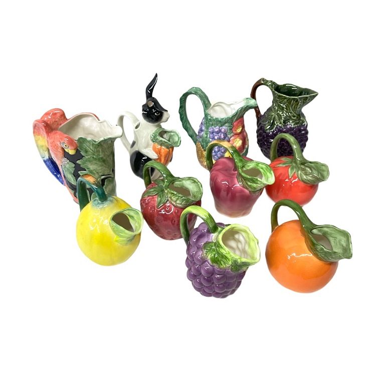 Appraisal: Lot of Porcelain Juice Jugs Painted jugs shaped like fruits