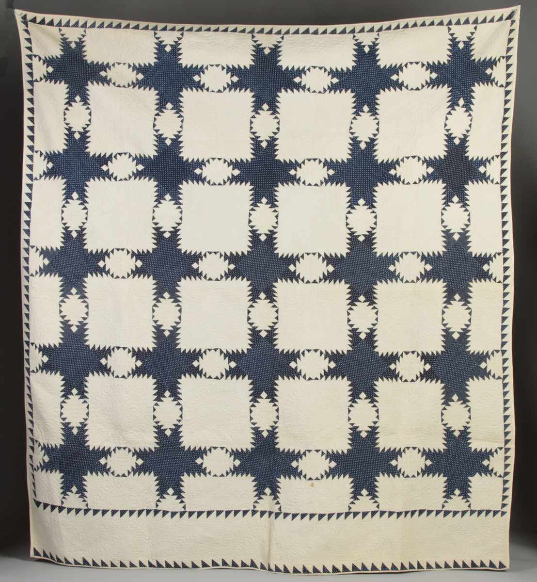 Appraisal: Dark Blue on White Patch Quilt Flying geese border pointed