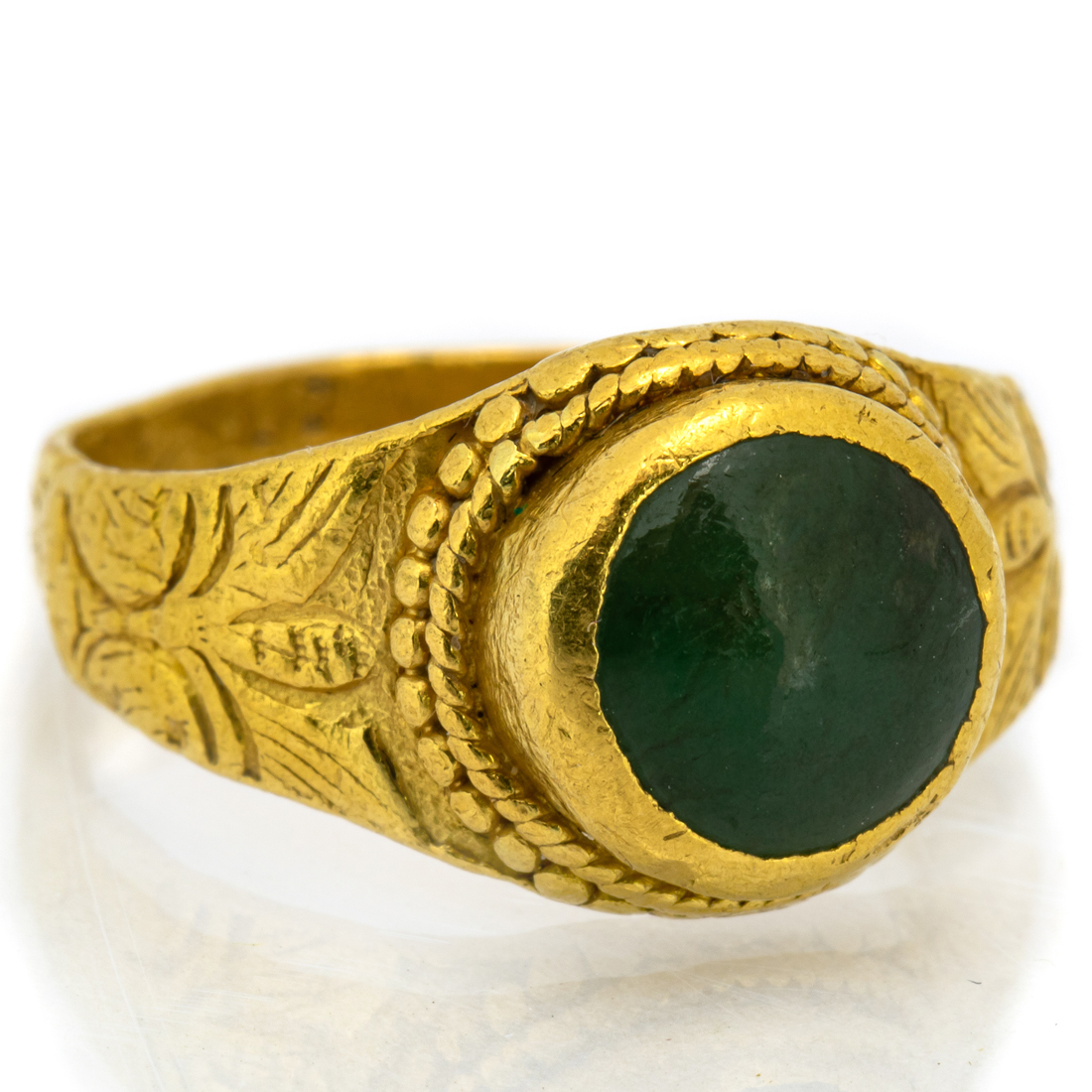 Appraisal: CHINESE GOLD RING Chinese gold ring mounted with a green