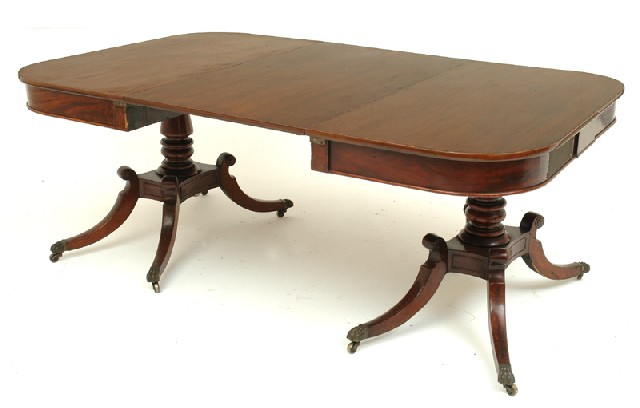 Appraisal: A REGENCY MAHOGANY DINING TABLE Two sectional with a rounded