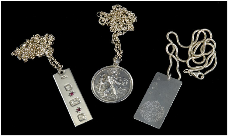 Appraisal: Three Silver Pendants And Chains Comprising St Christopher Hallmarked Birmingham