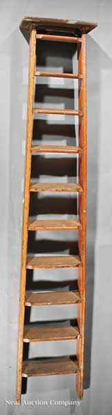 Appraisal: A Pine Library Ladder fitted with cast iron track support