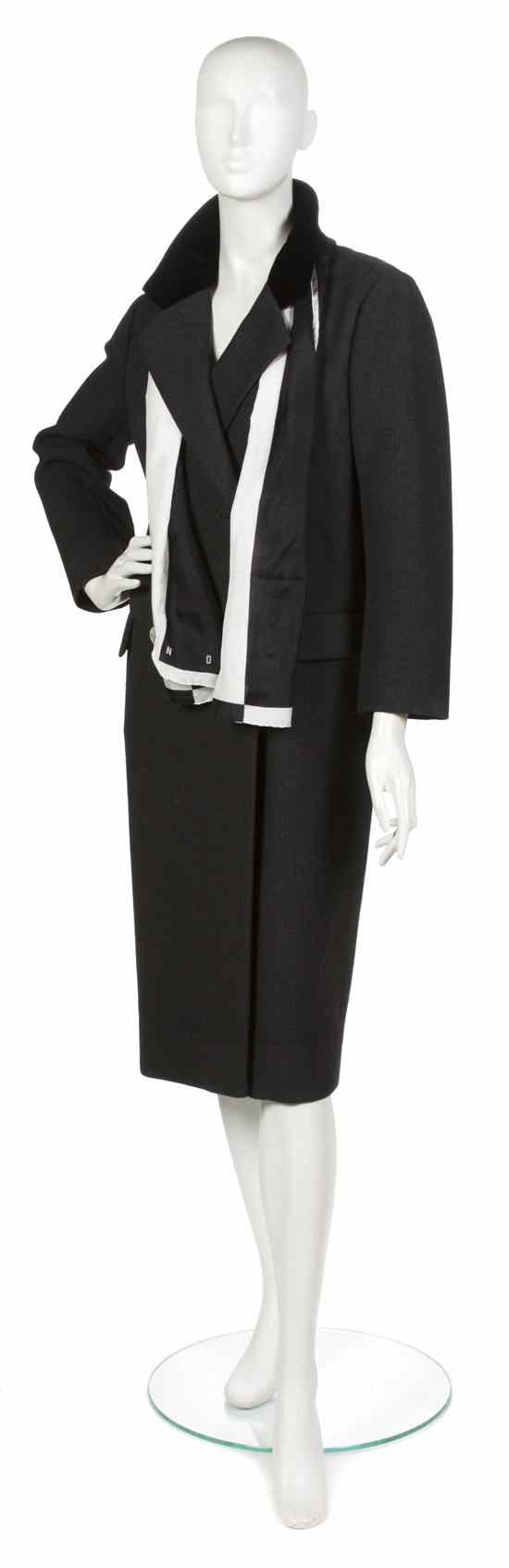 Appraisal: A Norman Norell Gray Coat s notched collar with the