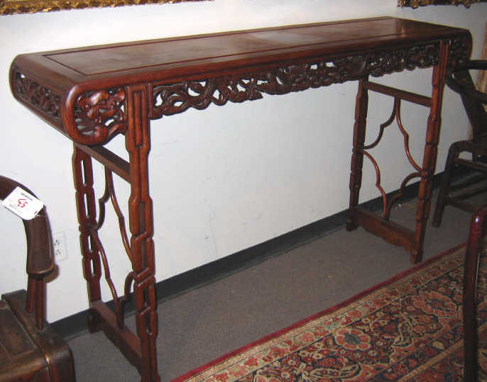 Appraisal: CHINESE LONG ALTAR TABLE Rectangular top with scrolling ends showing