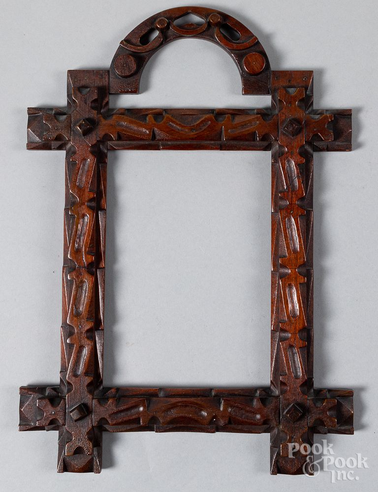 Appraisal: Carved walnut tramp art frame late th c Carved walnut