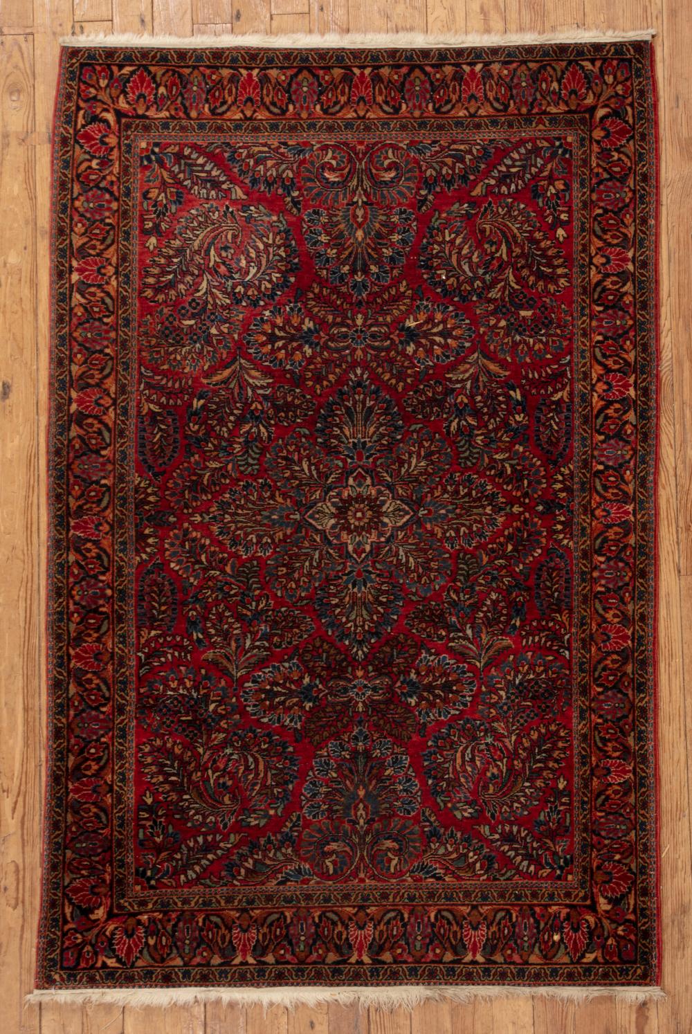 Appraisal: Persian Rug red ground foliate design ft in x ft