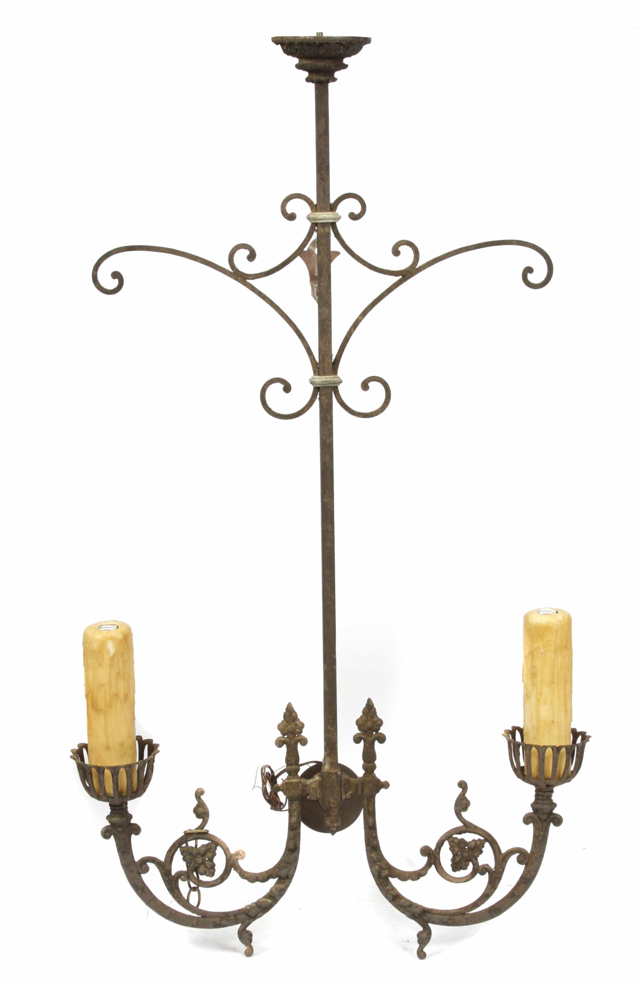 Appraisal: A pair of French Renaissance style two light iron wall