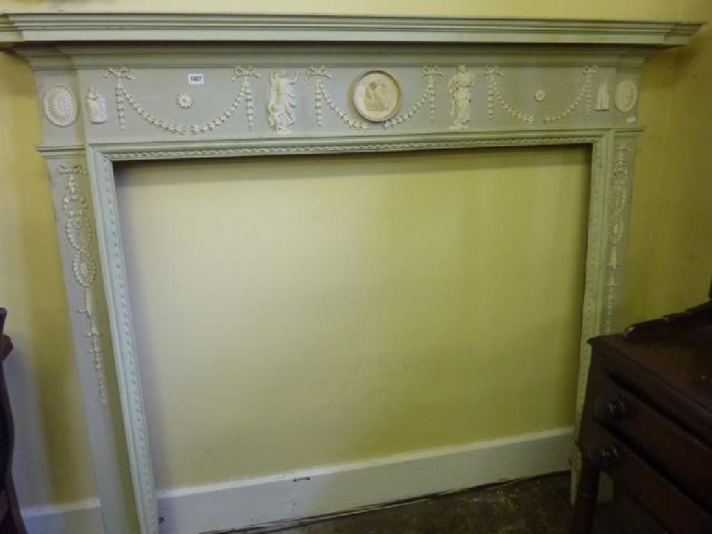 Appraisal: An Adam style fire surround with classical raised relief figural