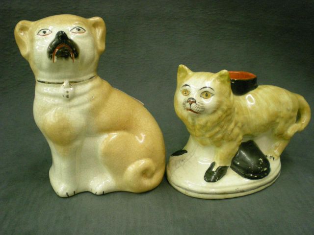 Appraisal: Staffordshire right-hand tan and white dog possibly a pug curly