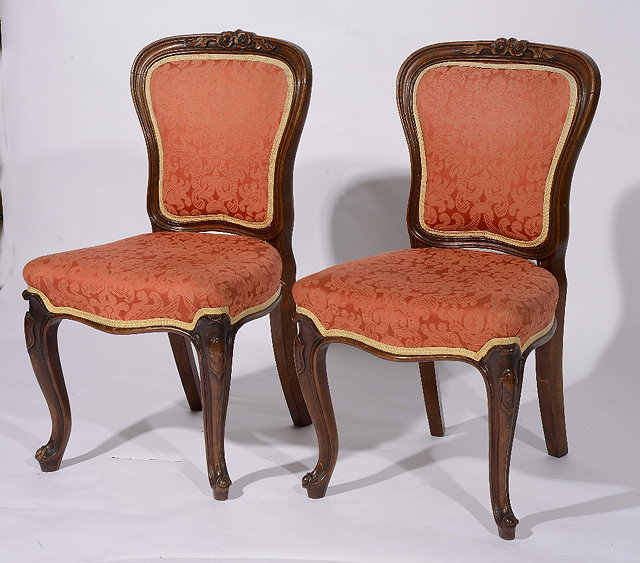 Appraisal: A set of six Victorian upholstered mahogany dining chairswith shaped