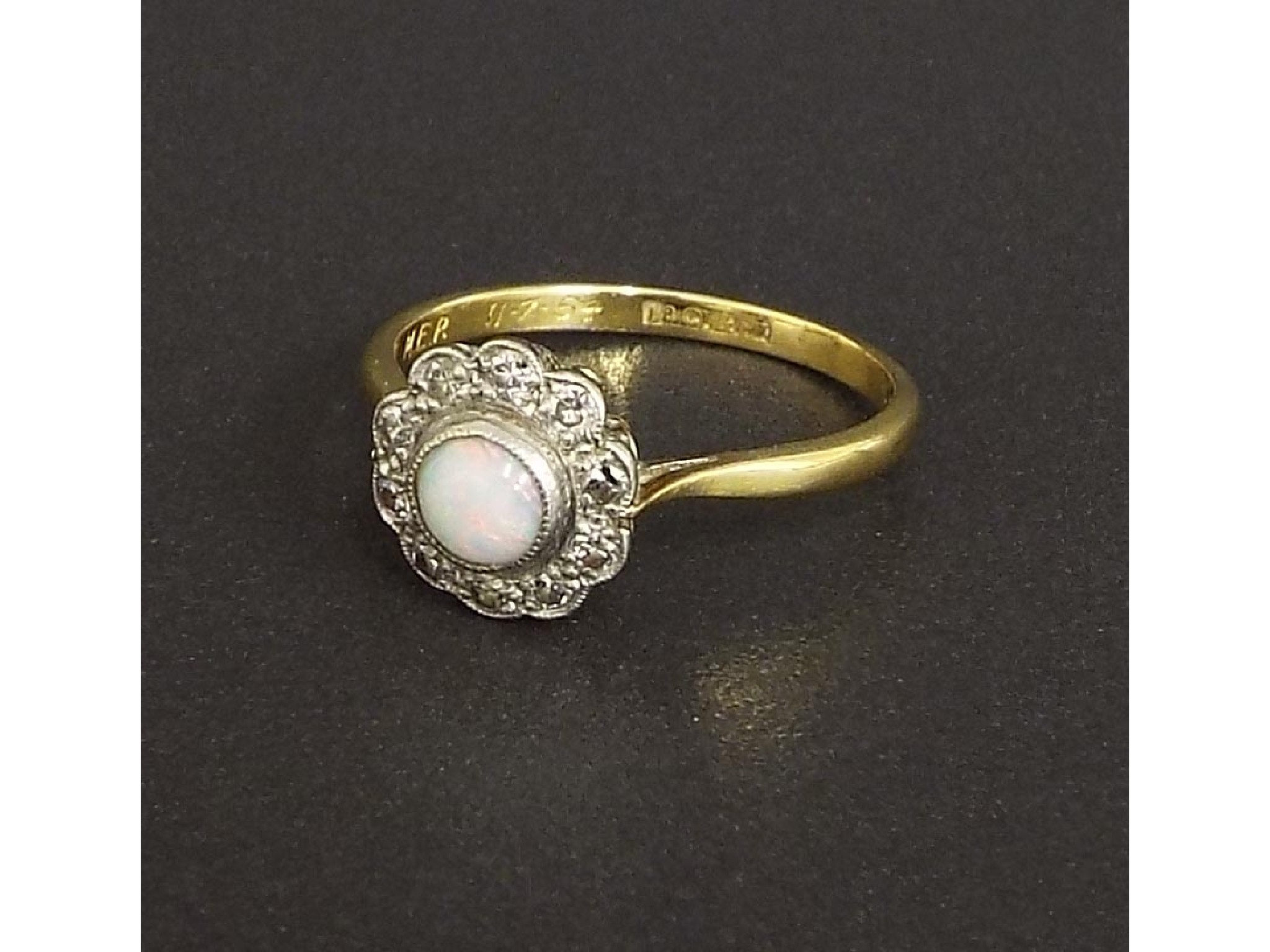 Appraisal: ct and platinum opal and diamond cluster ring with a