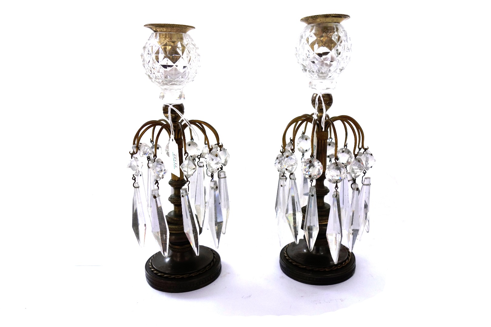 Appraisal: A pair of Regency cut glass brass and bronze candlesticks