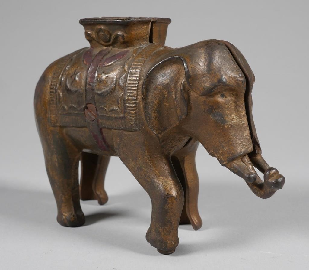 Appraisal: Cast iron elephant still bank with original gold paint Excellent