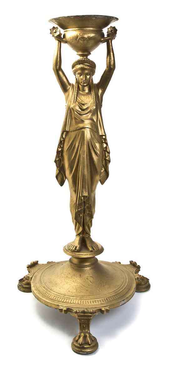 Appraisal: A Neoclassical Style Figural Stand depicting a robed maiden standing