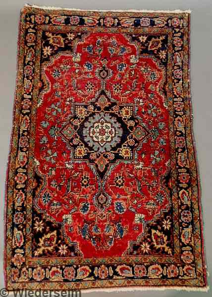 Appraisal: Sarouk oriental hall mat red field and center blue medallion