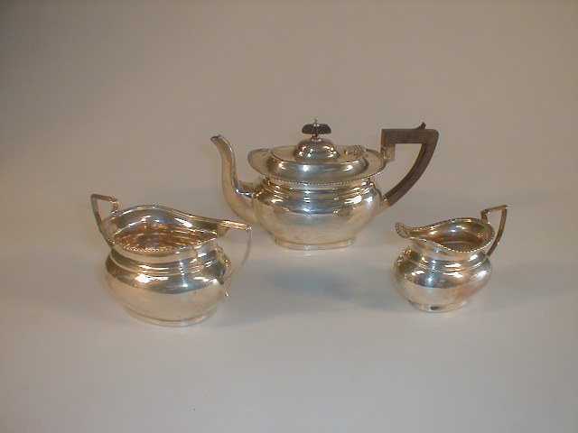 Appraisal: An Edwardian silver London shape bachelors three piece tea set