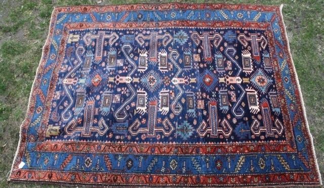 Appraisal: EARLY TH C CAUCASIAN RUG WITH A DRAMATIC NAVYBLUE FIELD