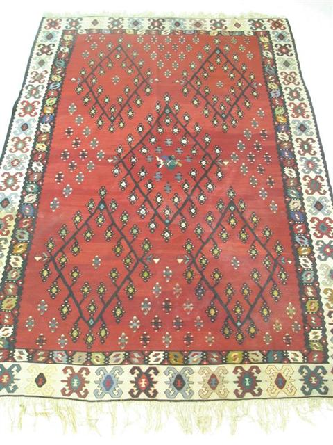 Appraisal: RED AND CREAM WOVEN AREA RUG X in