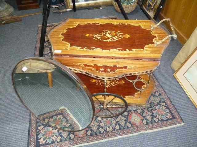 Appraisal: A 'S DRINKS TROLLEY with brass mounts and spoked wheels