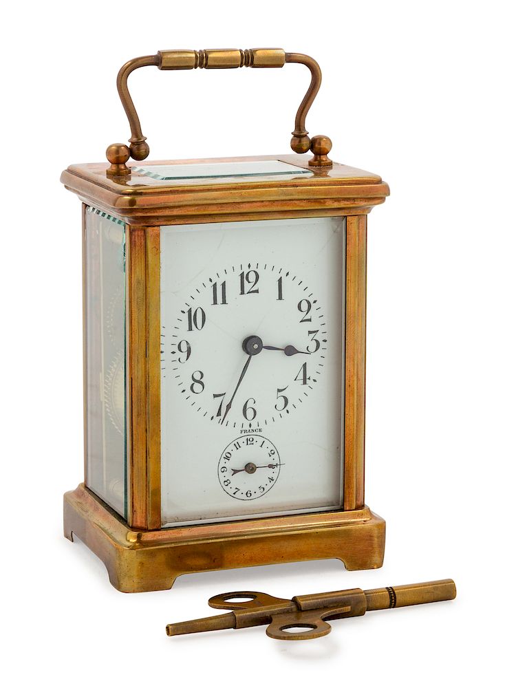 Appraisal: A French Brass Carriage Clock A French Brass Carriage Clock