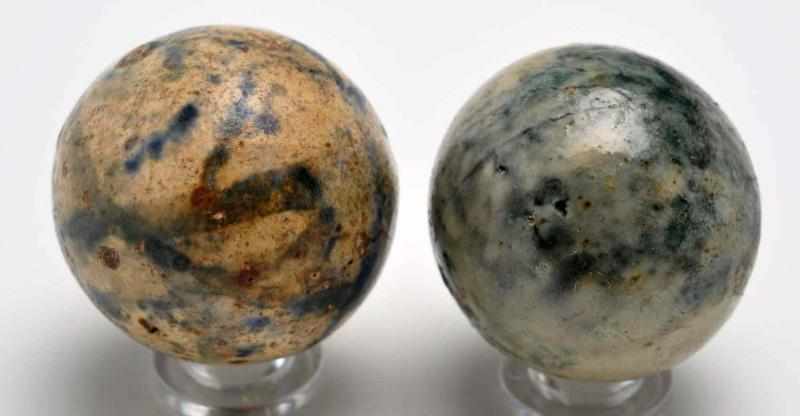 Appraisal: Lot of Stoneware Marbles Description Includes two stoneware marbles decorated