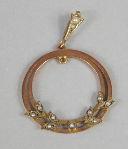 Appraisal: A pendant of circular form set with seed pearls in