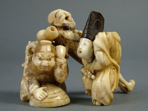 Appraisal: A Japanese ivory netsuke of a kneeling figure with a