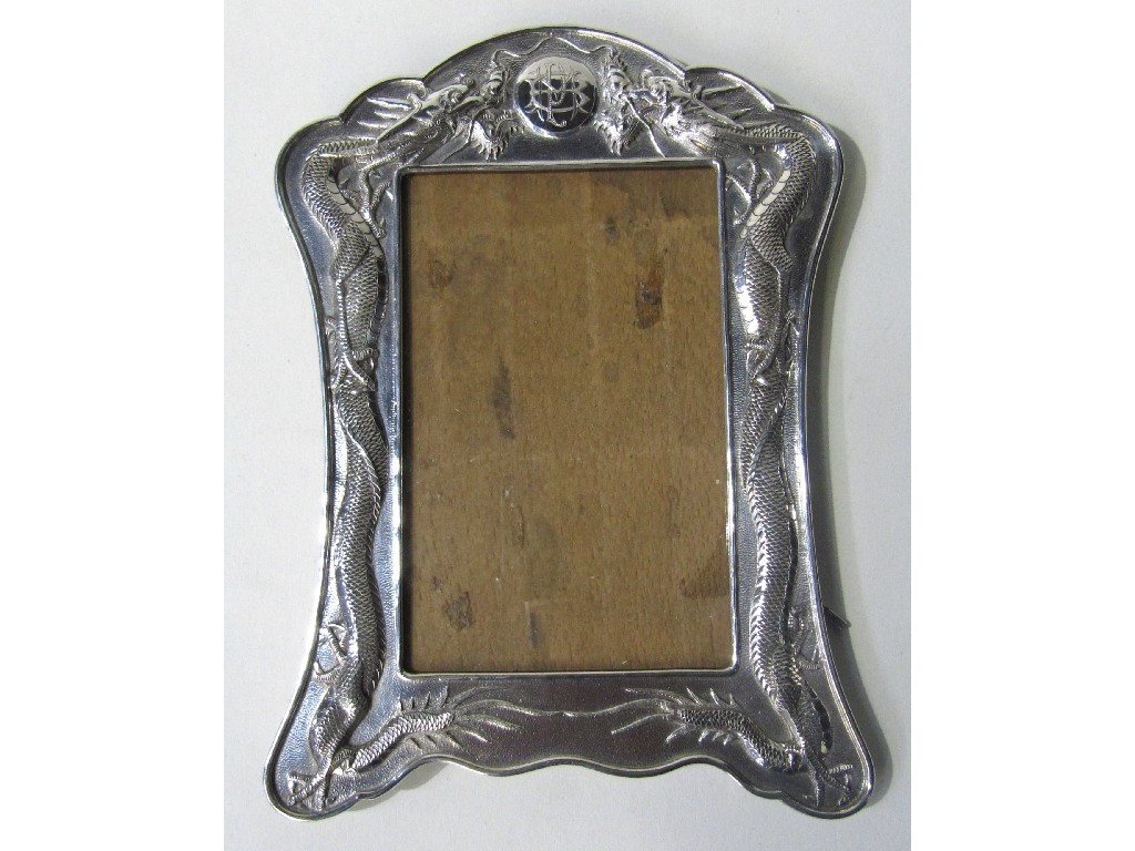 Appraisal: Oriental style white metal mounted photo frame with dragon decoration