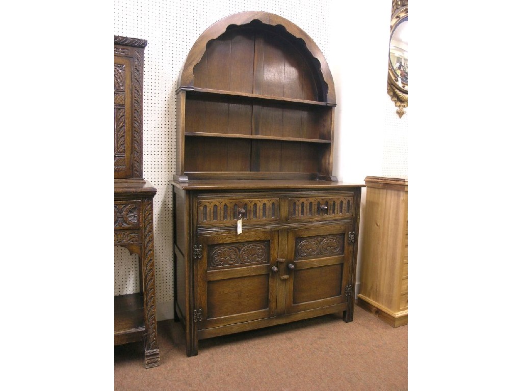 Appraisal: A dark oak Welsh dresser canopy with two fitted shelves