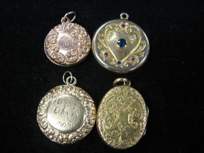 Appraisal: Four circular lockets One with coat of arms shield shape