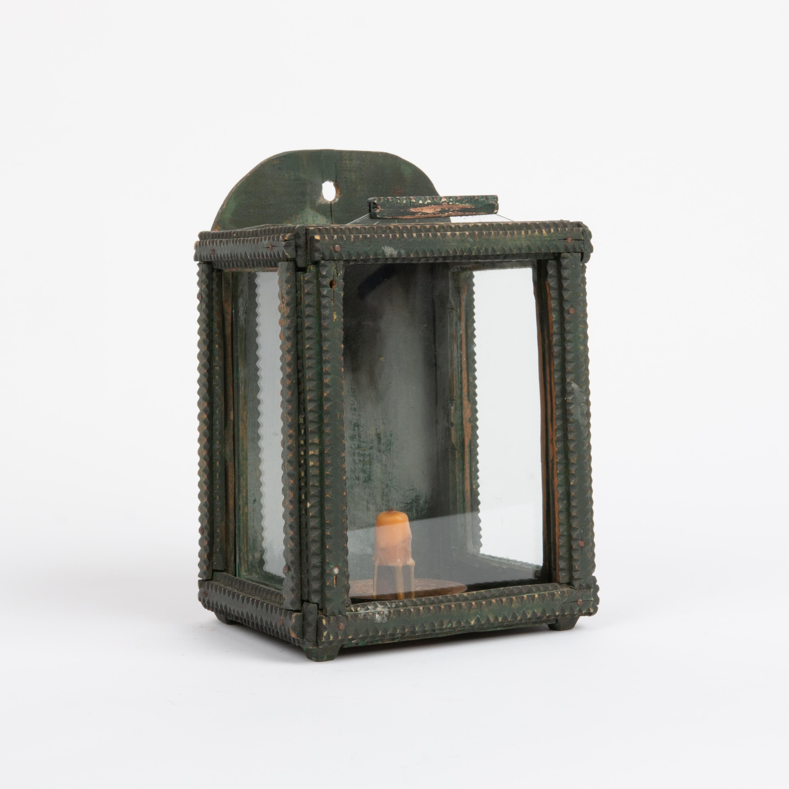 Appraisal: FOLK ART GREEN PAINTED CANDLE SCONCE A glass encased candle