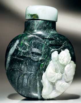 Appraisal: CHLOROMELANITE SNUFF BOTTLE Large and well hollowed chloromelanite jadeite snuff