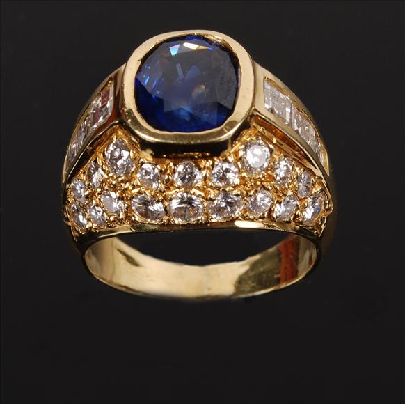 Appraisal: A sapphire and diamond ring centring on an oval sapphire