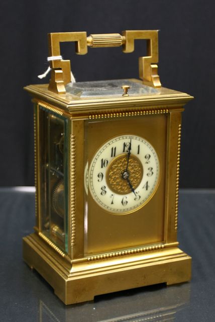 Appraisal: A French brass and gilt metal carriage clock with repeater