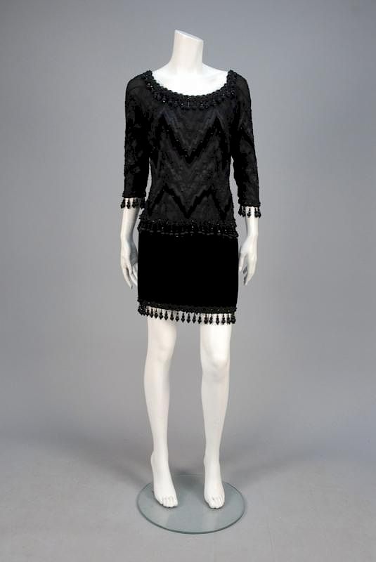 Appraisal: ODICINI BEADED COCKTAIL DRESS c Black with georgette scoop-neck bodice