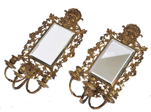 Appraisal: A PAIR OF ANTIQUE GILT BRASS GIRANDOLE MIRRORS with mask