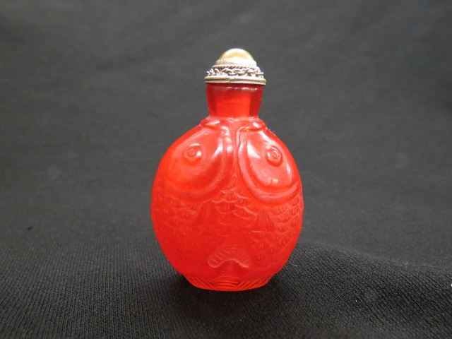 Appraisal: Chinese Art Glass Snuff Bottle fish decor vivid amber excellent