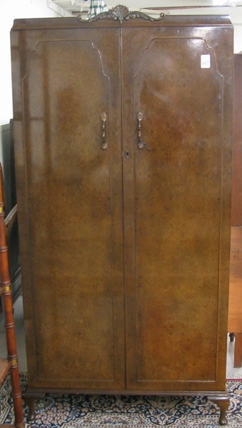 Appraisal: BURL WALNUT VENEER AND MAHOGANY WARDROBE Wrighton Furniture Co England