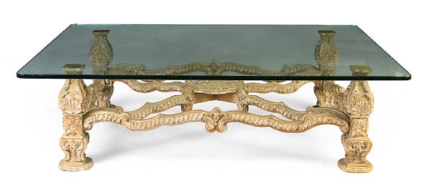 Appraisal: A Baroque style glass and carved wood coffee table height